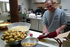 Lou Hammerman slicing potatoes