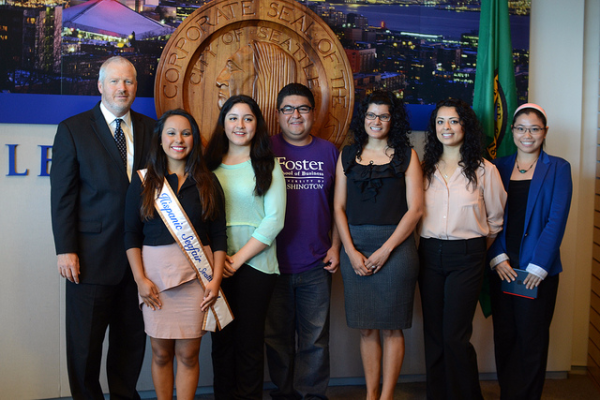 The mayor of Seattle poses with young people eligible for work and education authorizations through the federal Deferred Action for Childhood Arrival program.