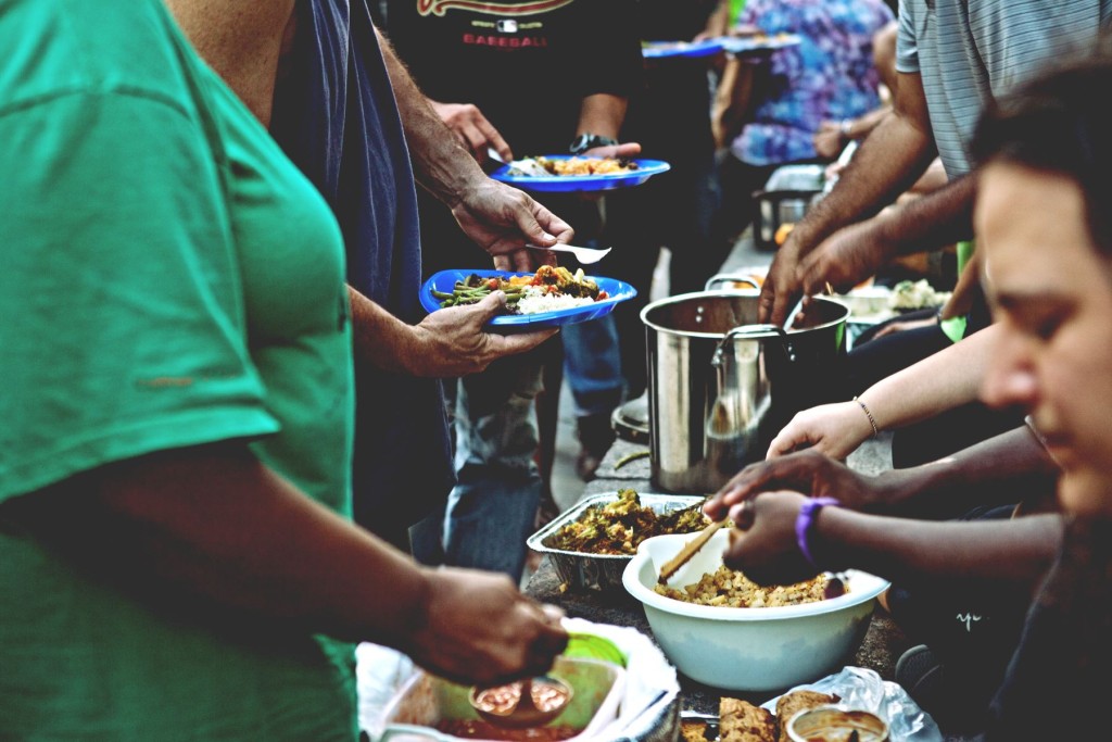 Volunteers at "Food Not Bombs" feed the Homeless and Needy.
